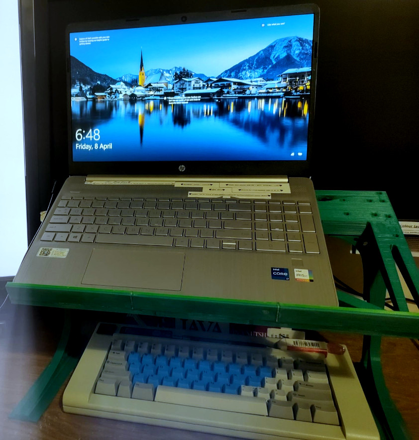 Laptop stand from front with laptop.
